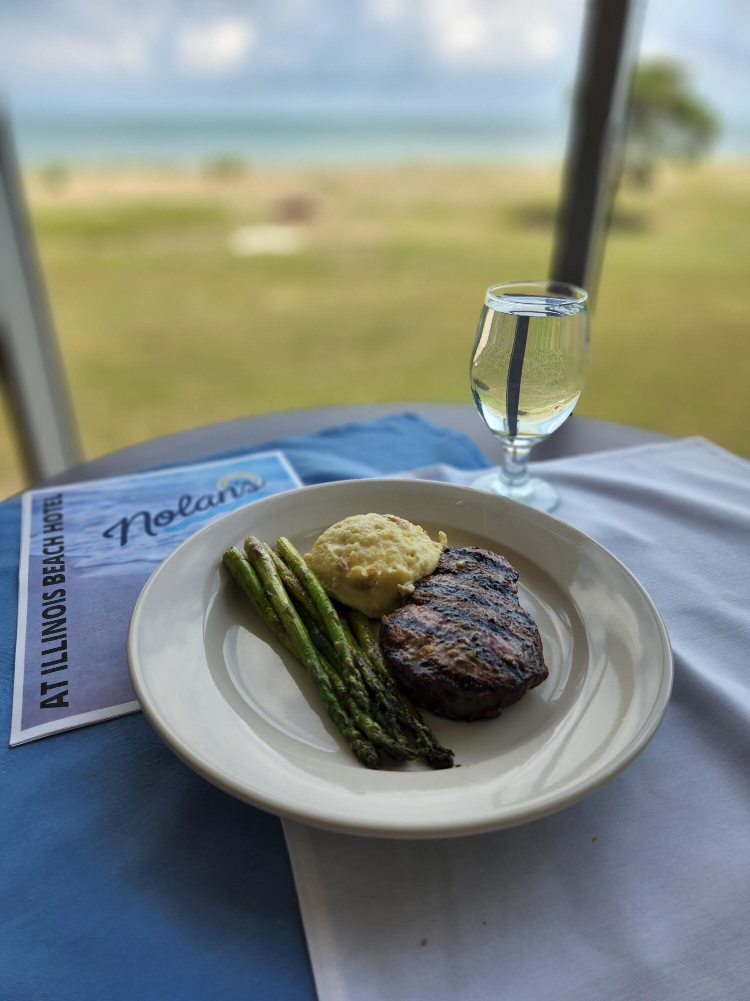 Come experience Nolan's Restaurant located inside Illinois Beach Hotel. Steak with Asparagus and Potatoes.